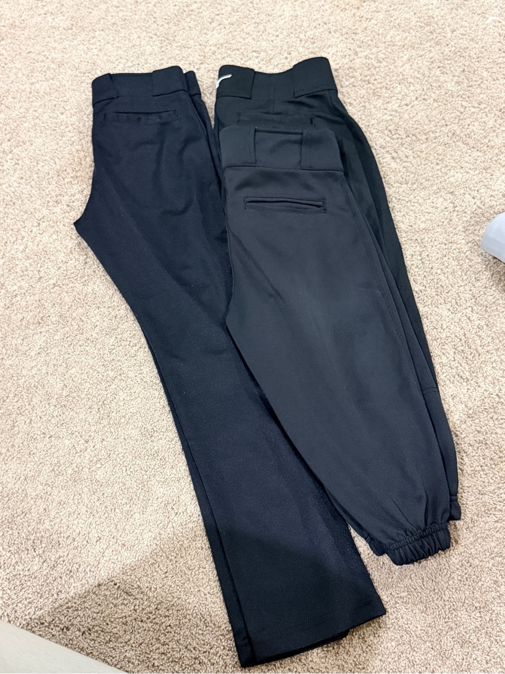 3 pair black baseball pants. 1 long pair Easton. 2 knickers champro